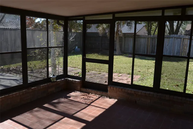 a living room with large windows