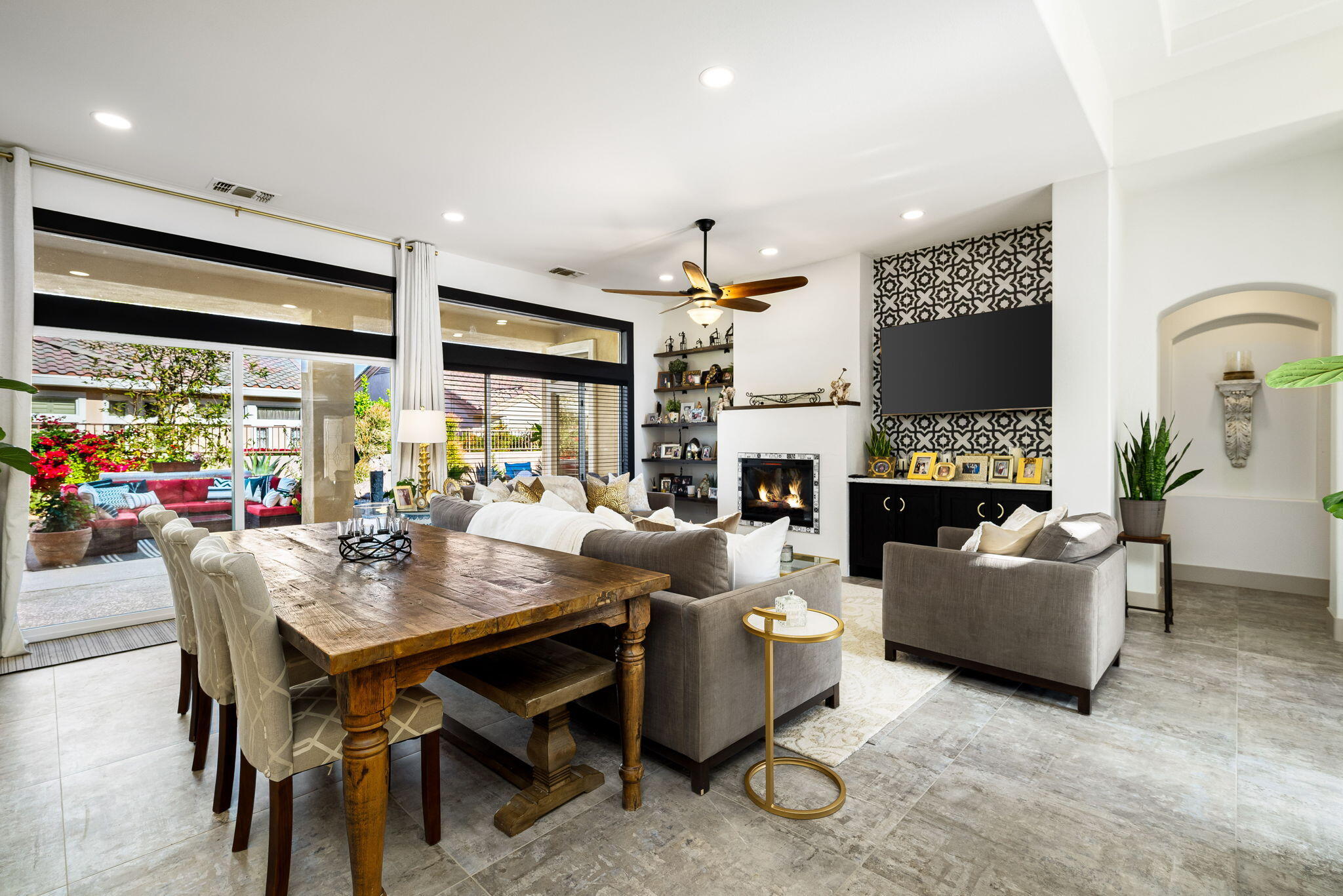 78618 Dancing Waters Road Palm Desert, CA 92211 - Photo 12 of 38 a living room with fireplace furniture and a large window