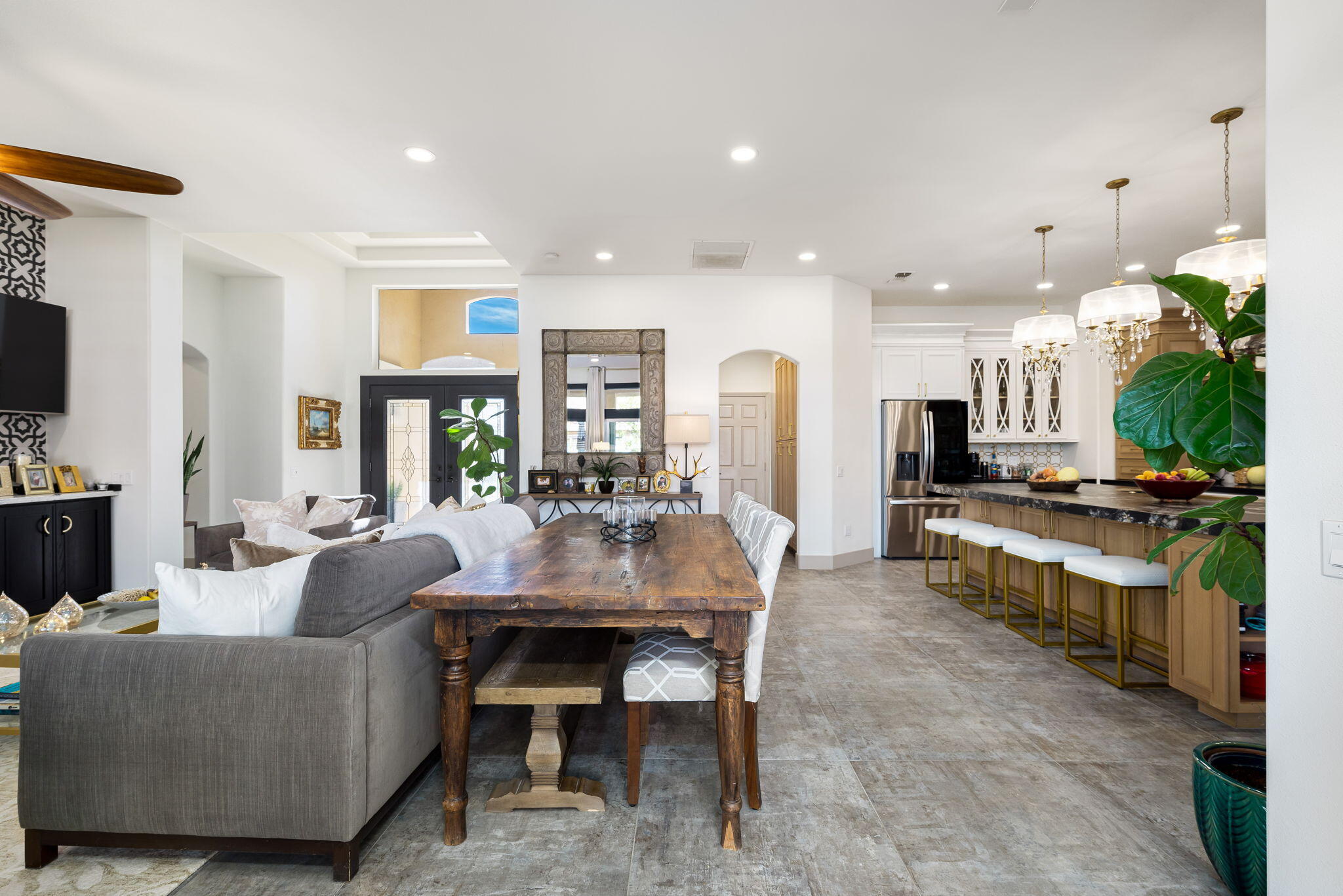 78618 Dancing Waters Road Palm Desert, CA 92211 - Photo 16 of 38 a living room with kitchen island furniture and a kitchen view