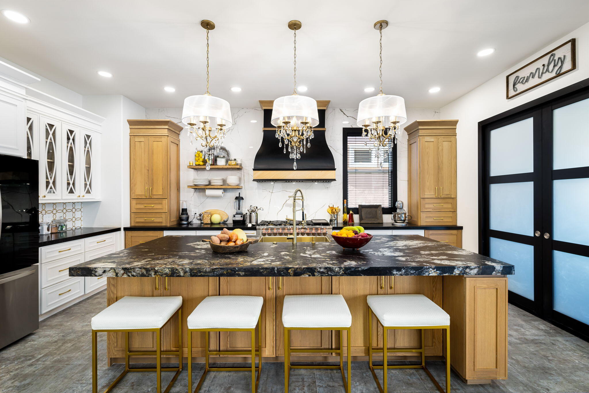 78618 Dancing Waters Road Palm Desert, CA 92211 - Photo 19 of 38 a kitchen with granite countertop a stove a sink a dining table and chairs