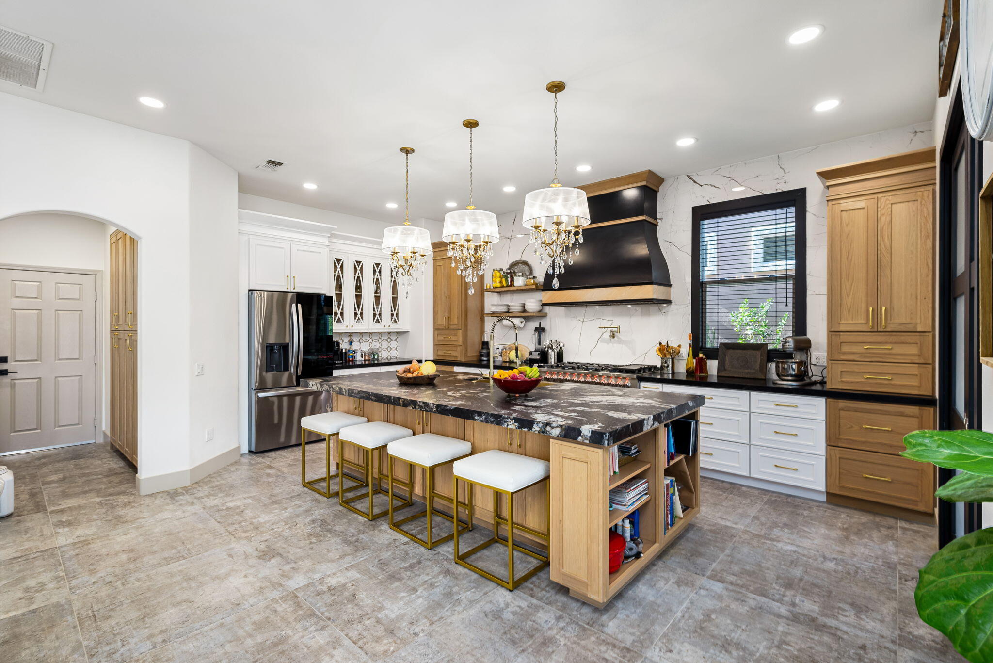 78618 Dancing Waters Road Palm Desert, CA 92211 - Photo 20 of 38 a kitchen with stainless steel appliances granite countertop a stove a sink and a refrigerator