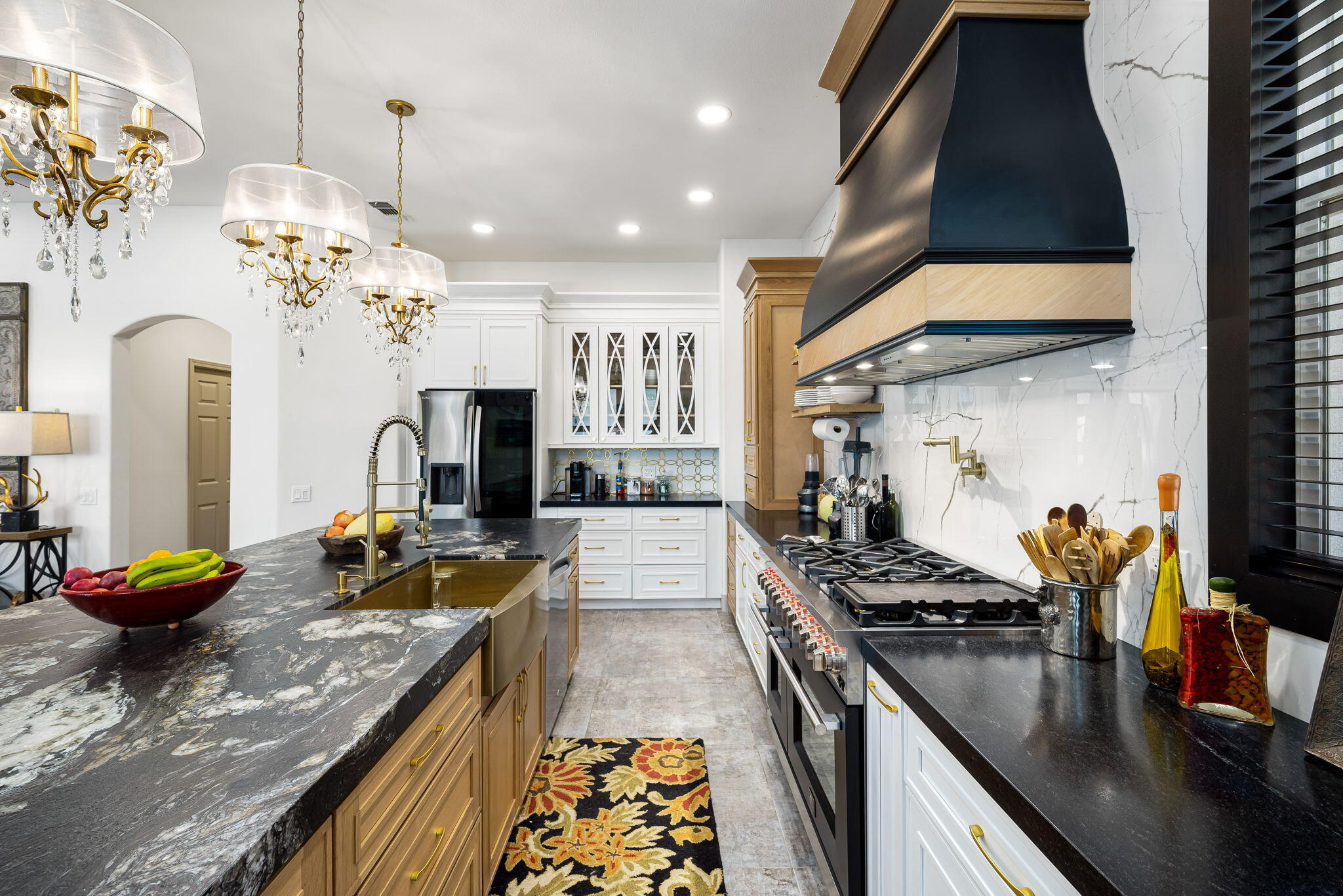 78618 Dancing Waters Road Palm Desert, CA 92211 - Photo 21 of 38 a kitchen with stove and a living room