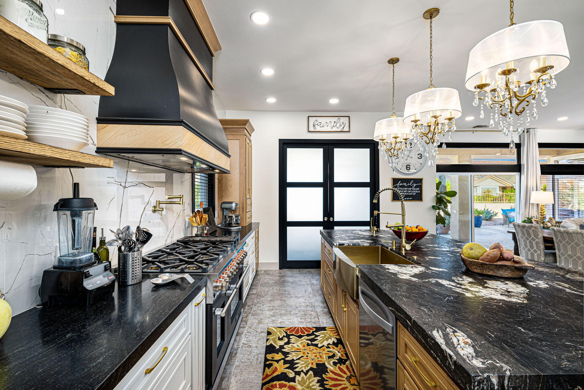 78618 Dancing Waters Road Palm Desert, CA 92211 - Photo 24 of 38 a kitchen with stainless steel appliances granite countertop a stove a sink and a refrigerator