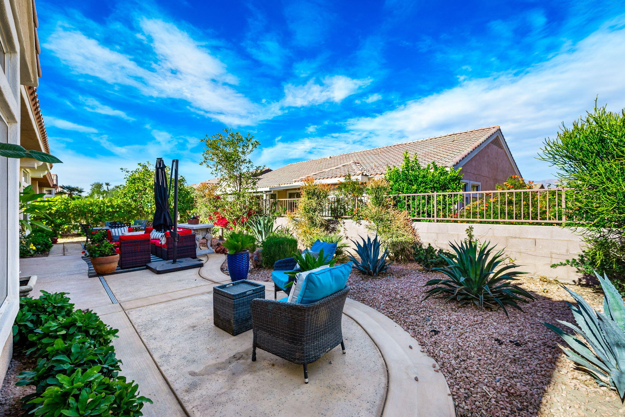 78618 Dancing Waters Road Palm Desert, CA 92211 - Photo 27 of 38 a view of a patio with potted plants and water fountain
