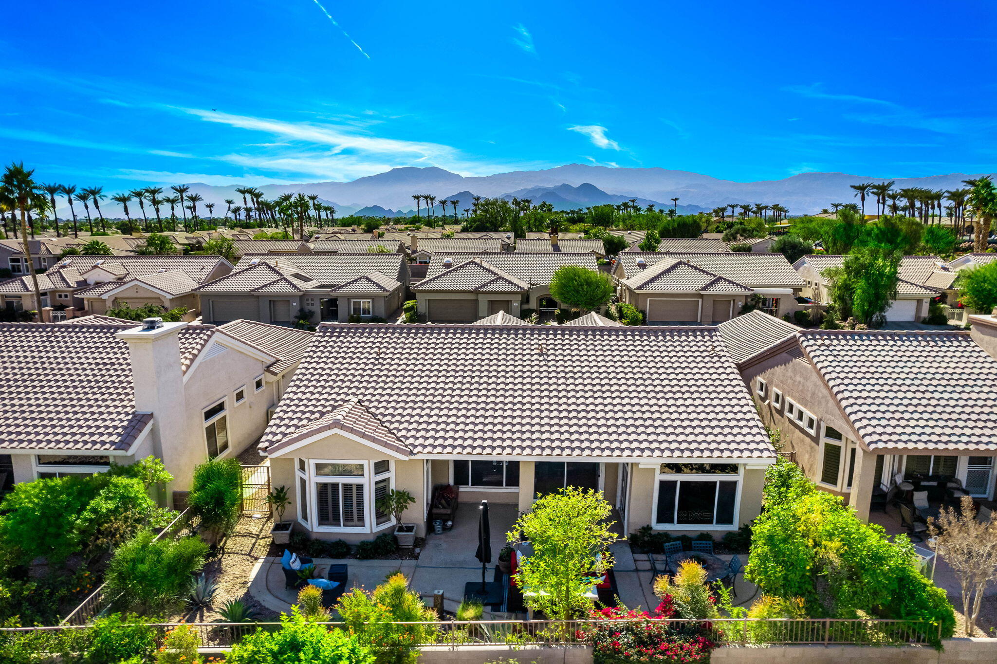 78618 Dancing Waters Road Palm Desert, CA 92211 - Photo 6 of 38 a view of a patio with plants and lake view