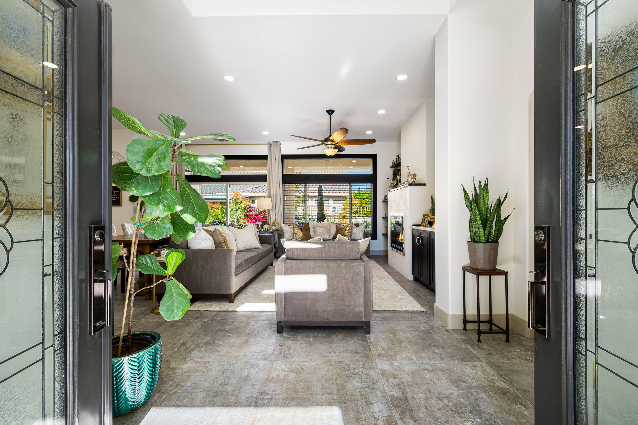 78618 Dancing Waters Road Palm Desert, CA 92211 - Photo 10 of 38 a living room with furniture and a potted plant