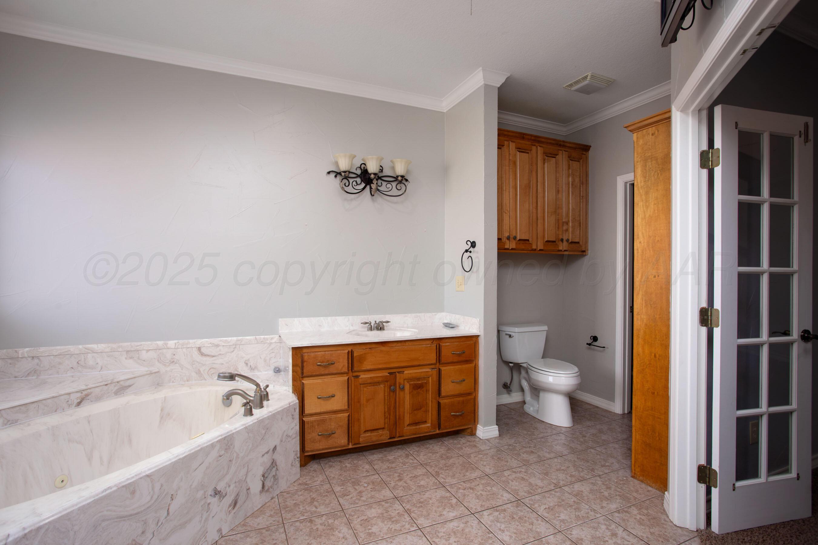 8900 Ottobahn Amarillo, TX 79119 - Photo 23 of 56 a bathroom with a bathtub sink and toilet