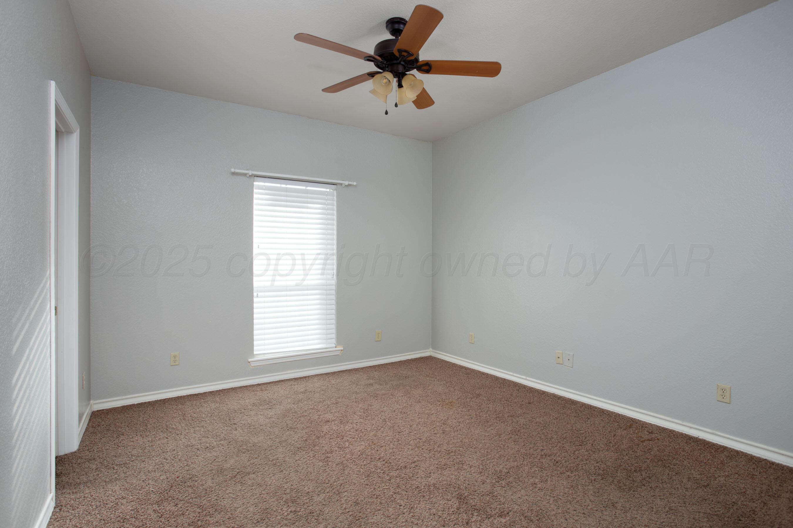 8900 Ottobahn Amarillo, TX 79119 - Photo 30 of 56 an empty room with a window and a fan