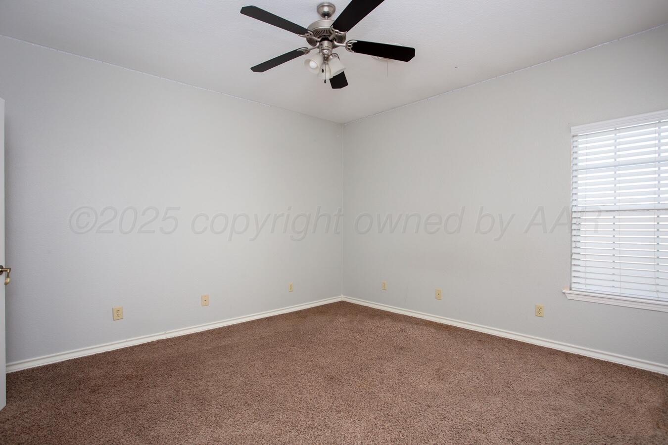 8900 Ottobahn Amarillo, TX 79119 - Photo 35 of 56 an empty room with a window and a fan