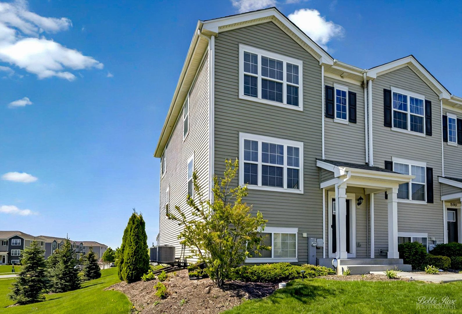 2451 Alison Avenue Pingree Grove, IL 60140 - Photo 2 of 47 a front view of a house with a yard