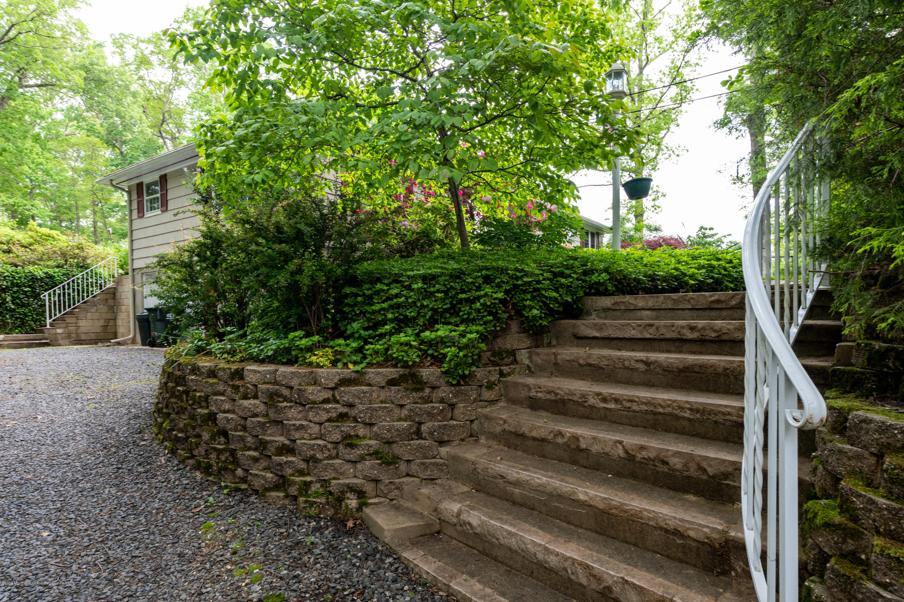 428 Brickyard Road Freehold, NJ 07728 - Photo 2 of 25 a view of a yard with plants and trees
