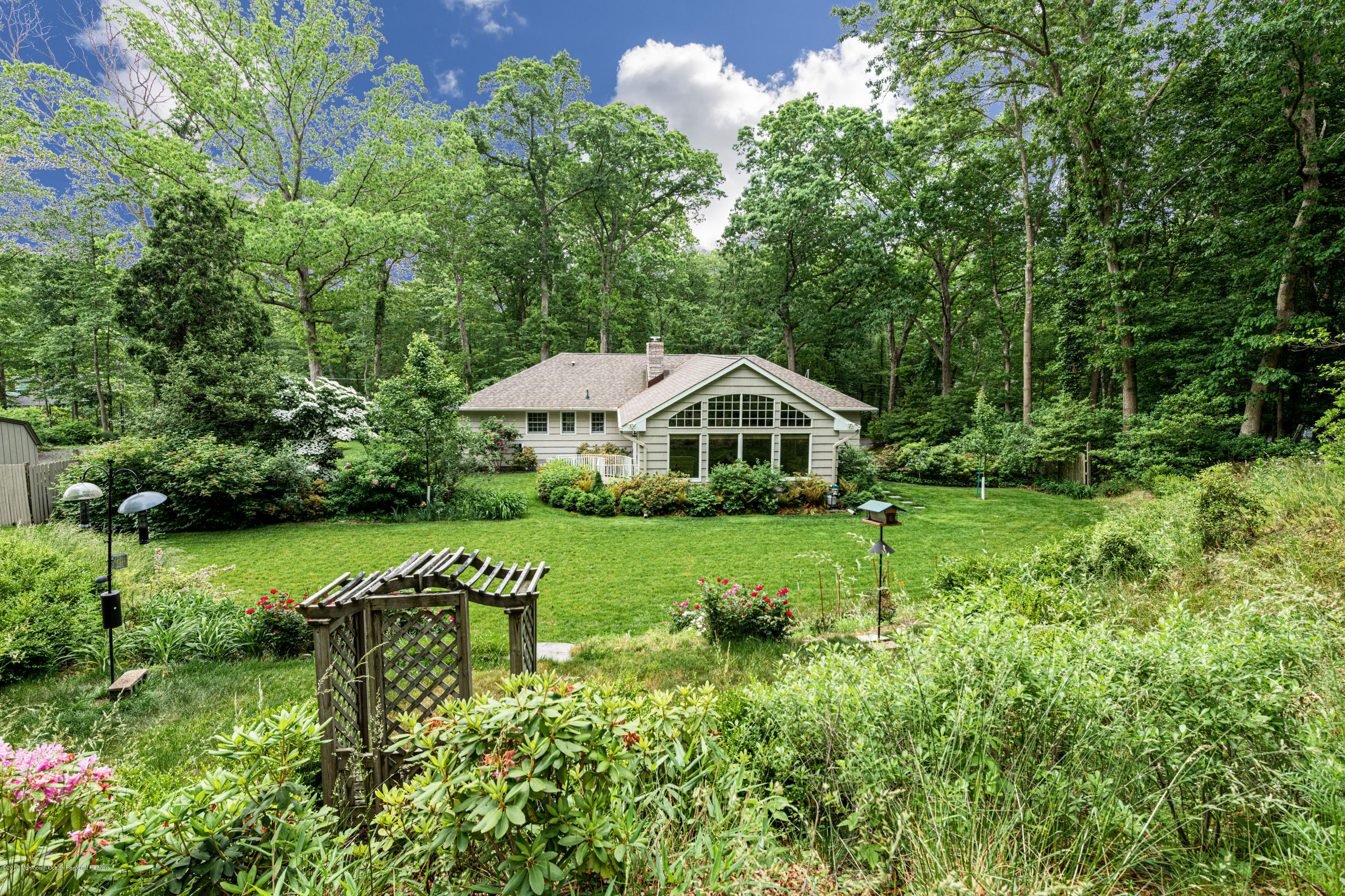 428 Brickyard Road Freehold, NJ 07728 - Photo 4 of 25 a view of swimming pool with table and chairs and potted plants
