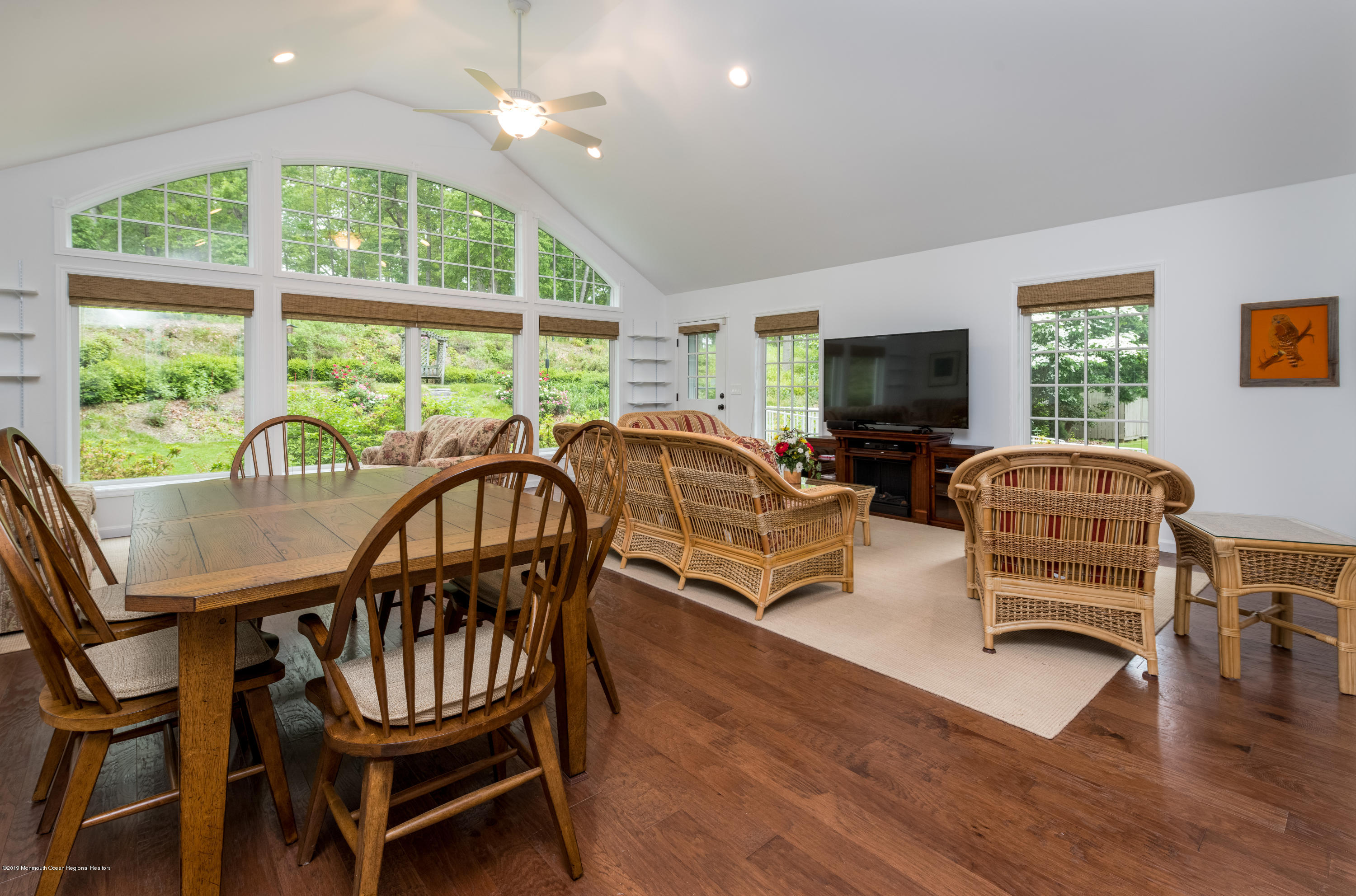 428 Brickyard Road Freehold, NJ 07728 - Photo 9 of 25 a living room with furniture a flat screen tv and windows