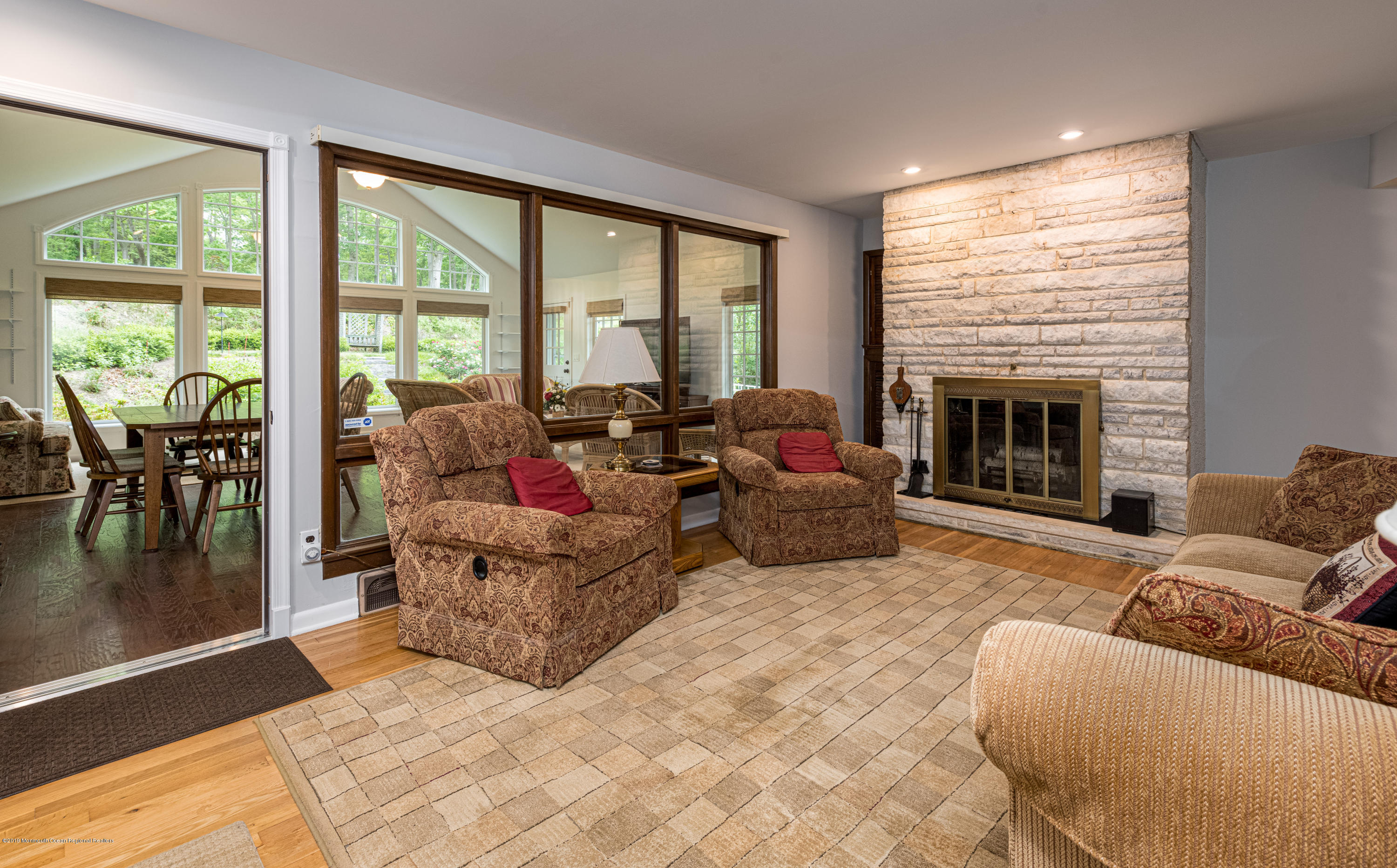 428 Brickyard Road Freehold, NJ 07728 - Photo 10 of 25 a living room with furniture and a fireplace