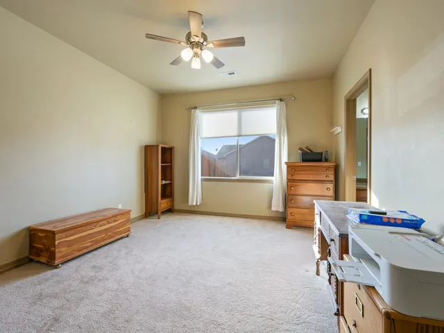 a view of room with furniture and a chandelier