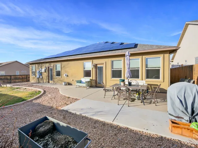 a view of swimming pool with outdoor seating