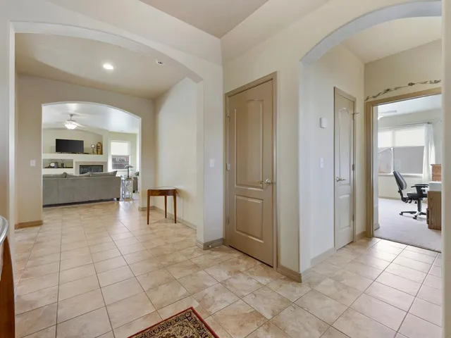 a view of a kitchen with furniture and an empty room