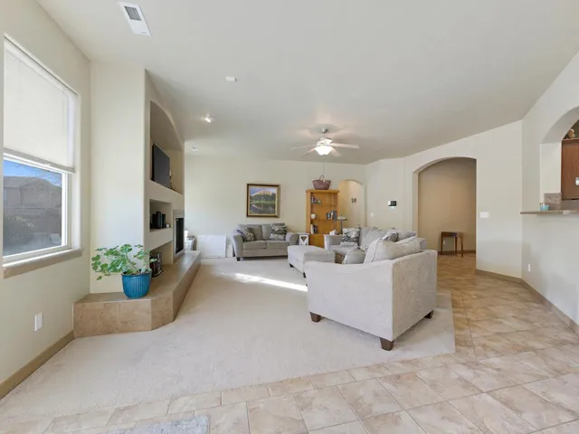 a living room with furniture and flowers