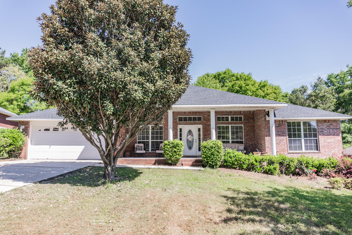 656 Territory Lane Crestview, FL 32536 - Photo 1 of 35 a front view of a house with garden
