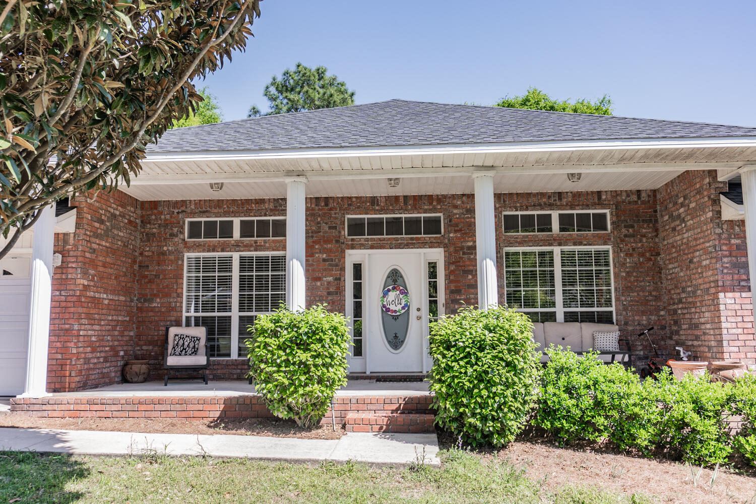 656 Territory Lane Crestview, FL 32536 - Photo 2 of 35 a front view of a house with garden