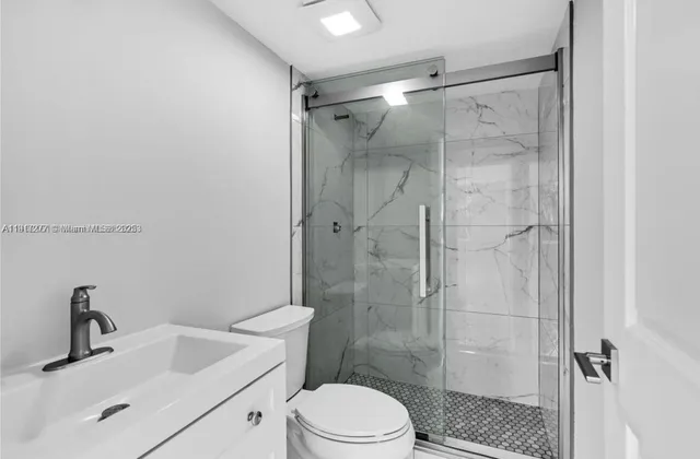 a view of a balcony with wooden floor and fence
