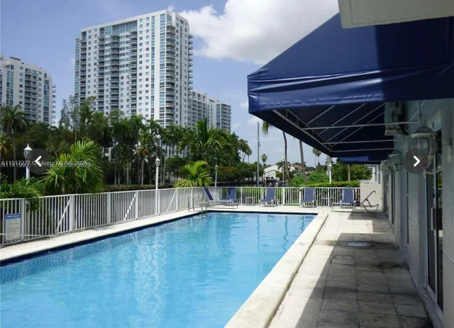 a view of a swimming pool with a lounge chairs