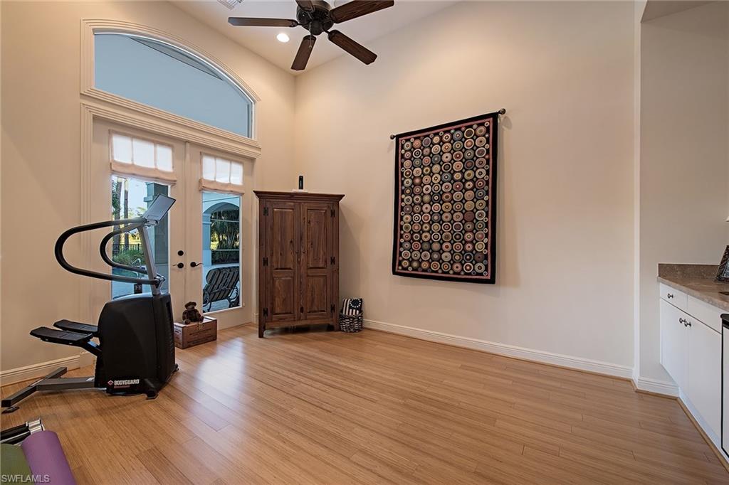 2618 Bulrush Lane Naples, FL 34105 - Photo 13 of 19 a view of an entryway with wooden floor and windows