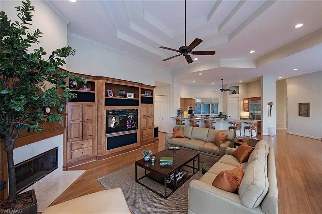2618 Bulrush Lane Naples, FL 34105 - Photo 3 of 19 a living room with furniture and a flat screen tv