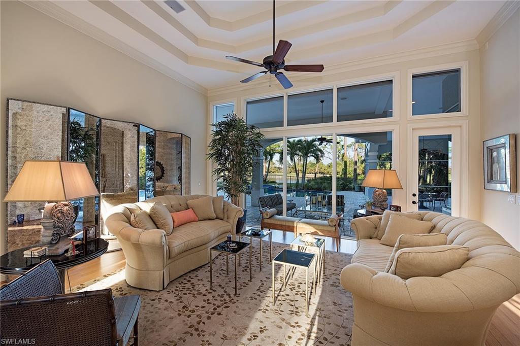 2618 Bulrush Lane Naples, FL 34105 - Photo 4 of 19 a living room with furniture and a flat screen tv