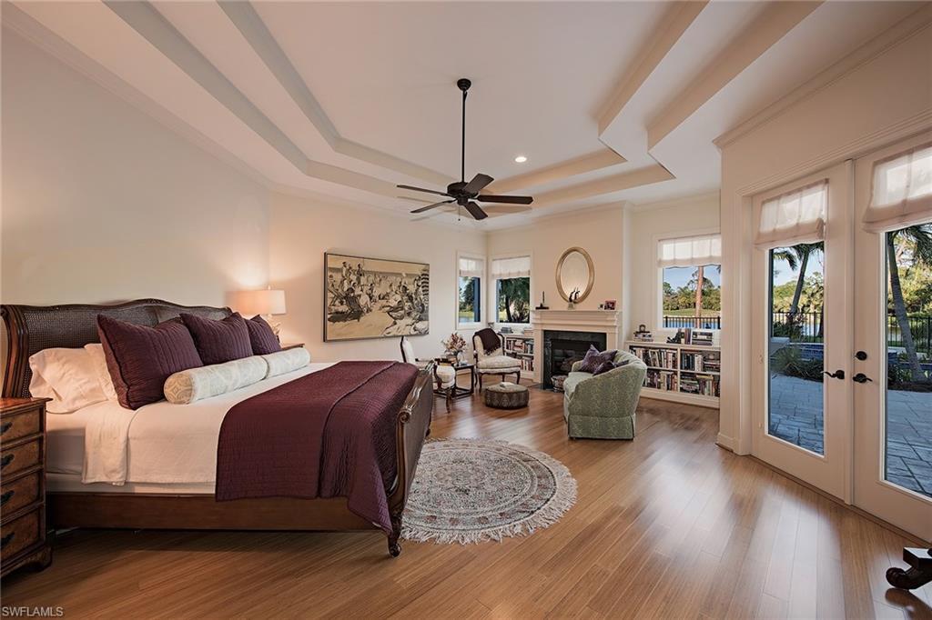 2618 Bulrush Lane Naples, FL 34105 - Photo 7 of 19 a bed room with bed furniture and wooden floor