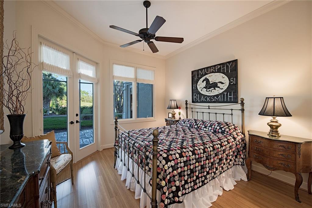 2618 Bulrush Lane Naples, FL 34105 - Photo 9 of 19 a bedroom with bed and wooden floor