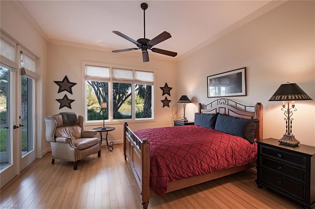 2618 Bulrush Lane Naples, FL 34105 - Photo 10 of 19 a bedroom with a bed and wooden floor