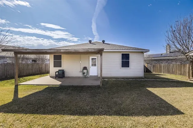 a view of a house with backyard and pool