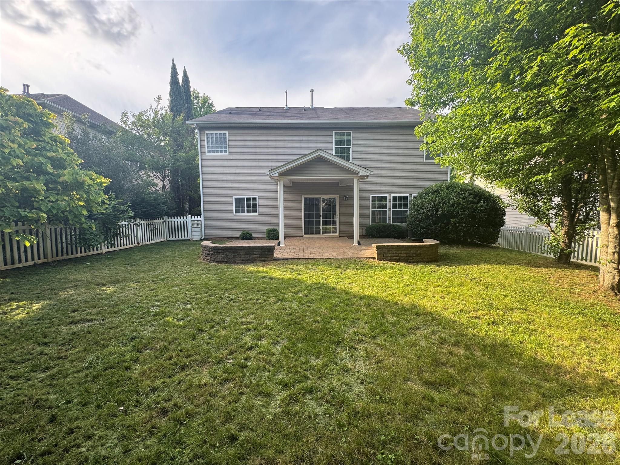10921 Rousay Road Charlotte, NC 28278 - Photo 16 of 17 a front view of a house with garden