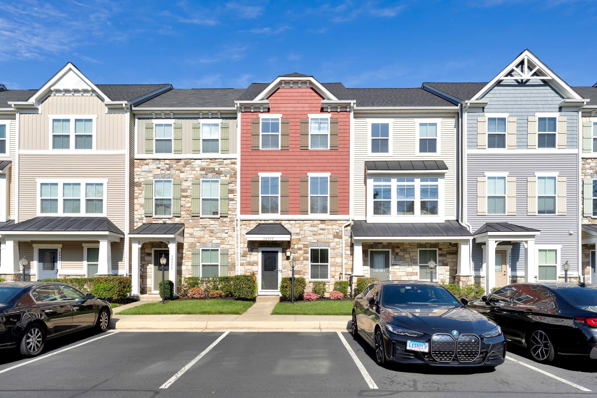 24977 Coats Square Aldie, VA 20105 - Photo 1 of 32 a front view of a residential apartment building with parking space