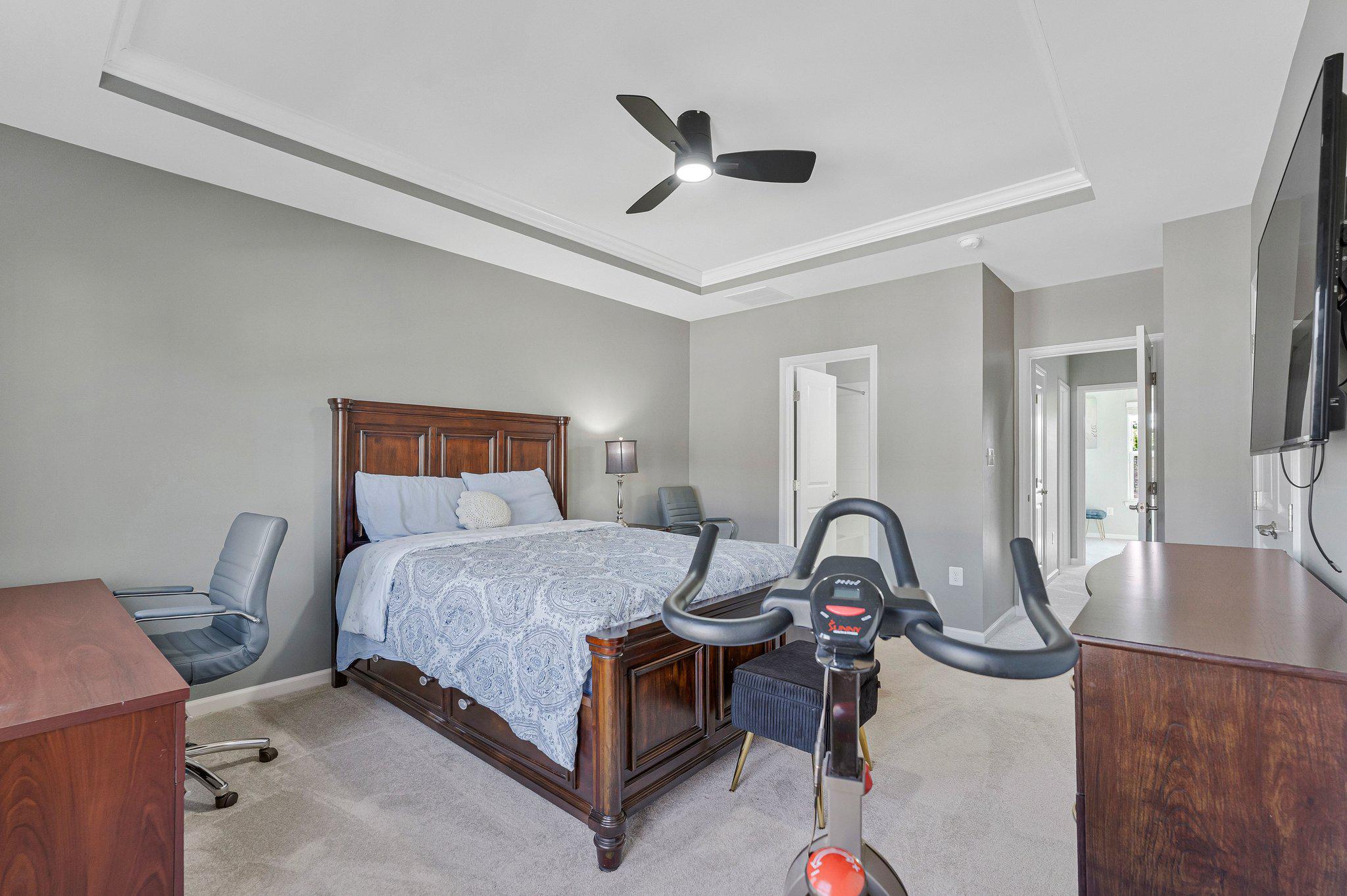 24977 Coats Square Aldie, VA 20105 - Photo 22 of 32 a bedroom with a bed and a dresser next to a window