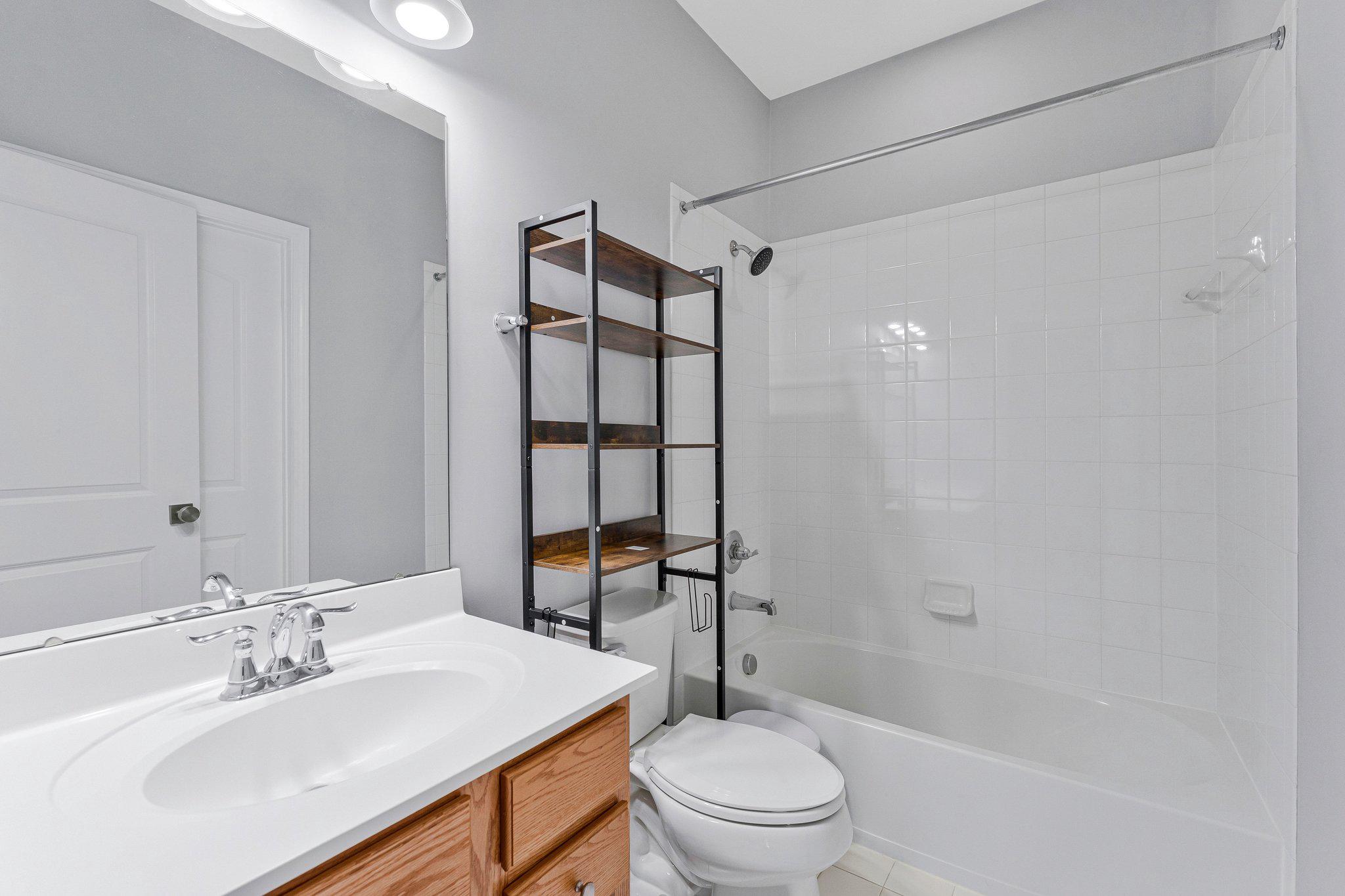 24977 Coats Square Aldie, VA 20105 - Photo 29 of 32 a bathroom with a sink toilet and shower