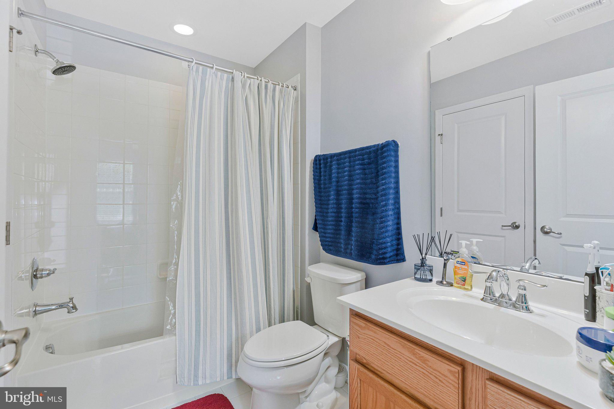 24977 Coats Square Aldie, VA 20105 - Photo 7 of 32 a bathroom with a sink toilet and shower