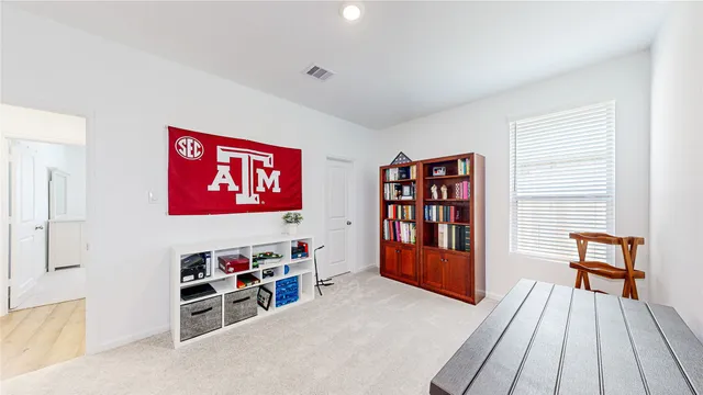 a view of a livingroom with furniture and toys