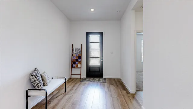 an empty room with wooden floor and closet