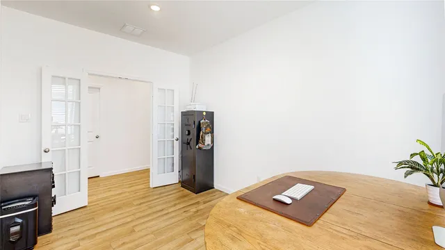 a bed room with a bed and a book shelf