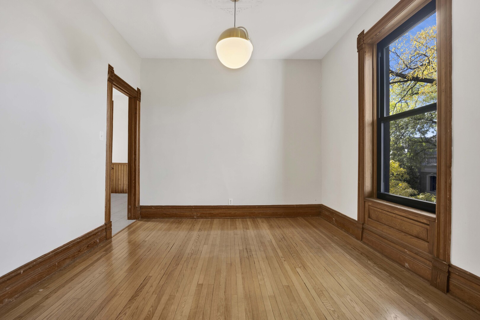 825 West Armitage Avenue, Unit 3S Chicago, IL 60614 - Photo 12 of 18 a view of an empty room with wooden floor and windows