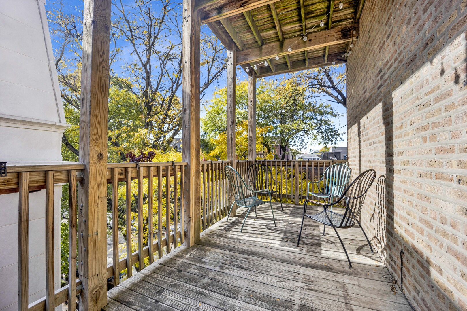 825 West Armitage Avenue, Unit 3S Chicago, IL 60614 - Photo 15 of 18 a view of balcony with wooden floor and outdoor seating