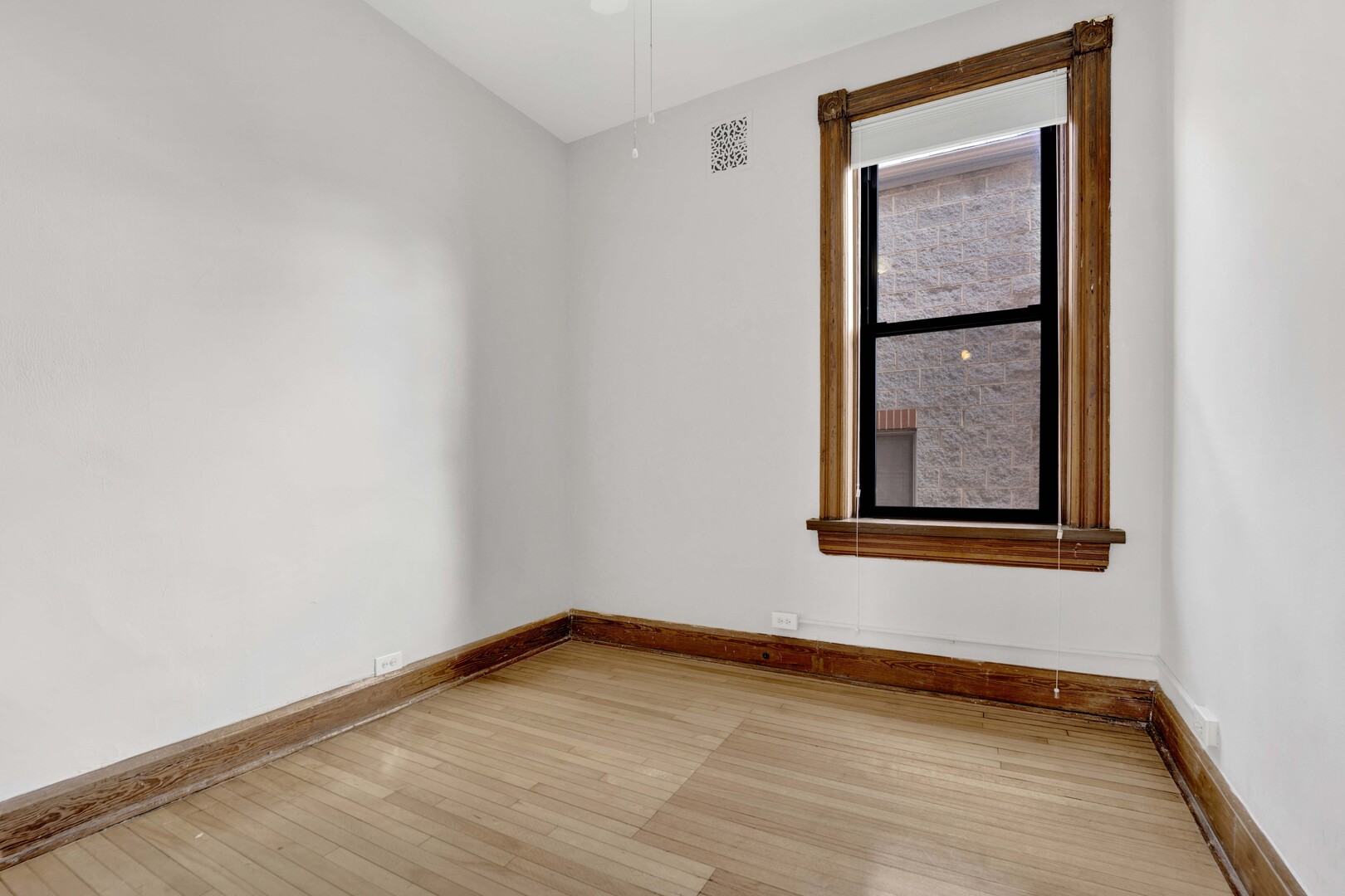 825 West Armitage Avenue, Unit 3S Chicago, IL 60614 - Photo 16 of 18 a view of an empty room with wooden floor and a window