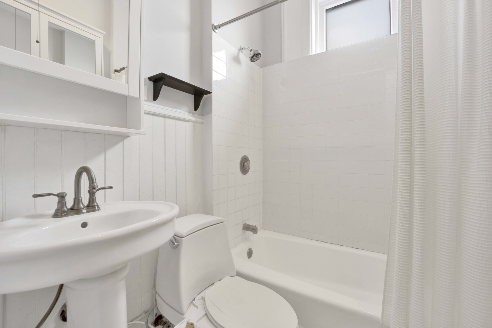 825 West Armitage Avenue, Unit 3S Chicago, IL 60614 - Photo 18 of 18 a bathroom with a bathtub shower sink and toilet