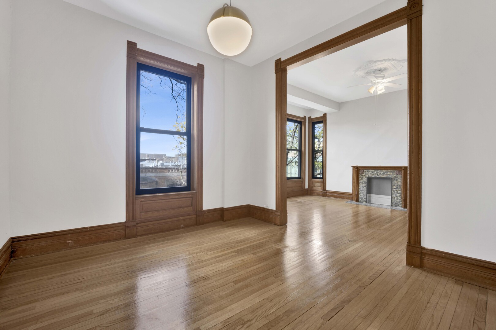825 West Armitage Avenue, Unit 3S Chicago, IL 60614 - Photo 3 of 18 a view of an empty room with wooden floor and a window