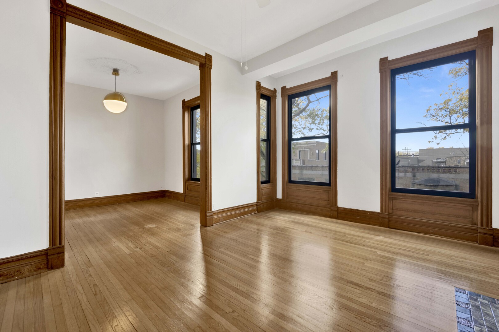 825 West Armitage Avenue, Unit 3S Chicago, IL 60614 - Photo 5 of 18 a view of an empty room with wooden floor and a window