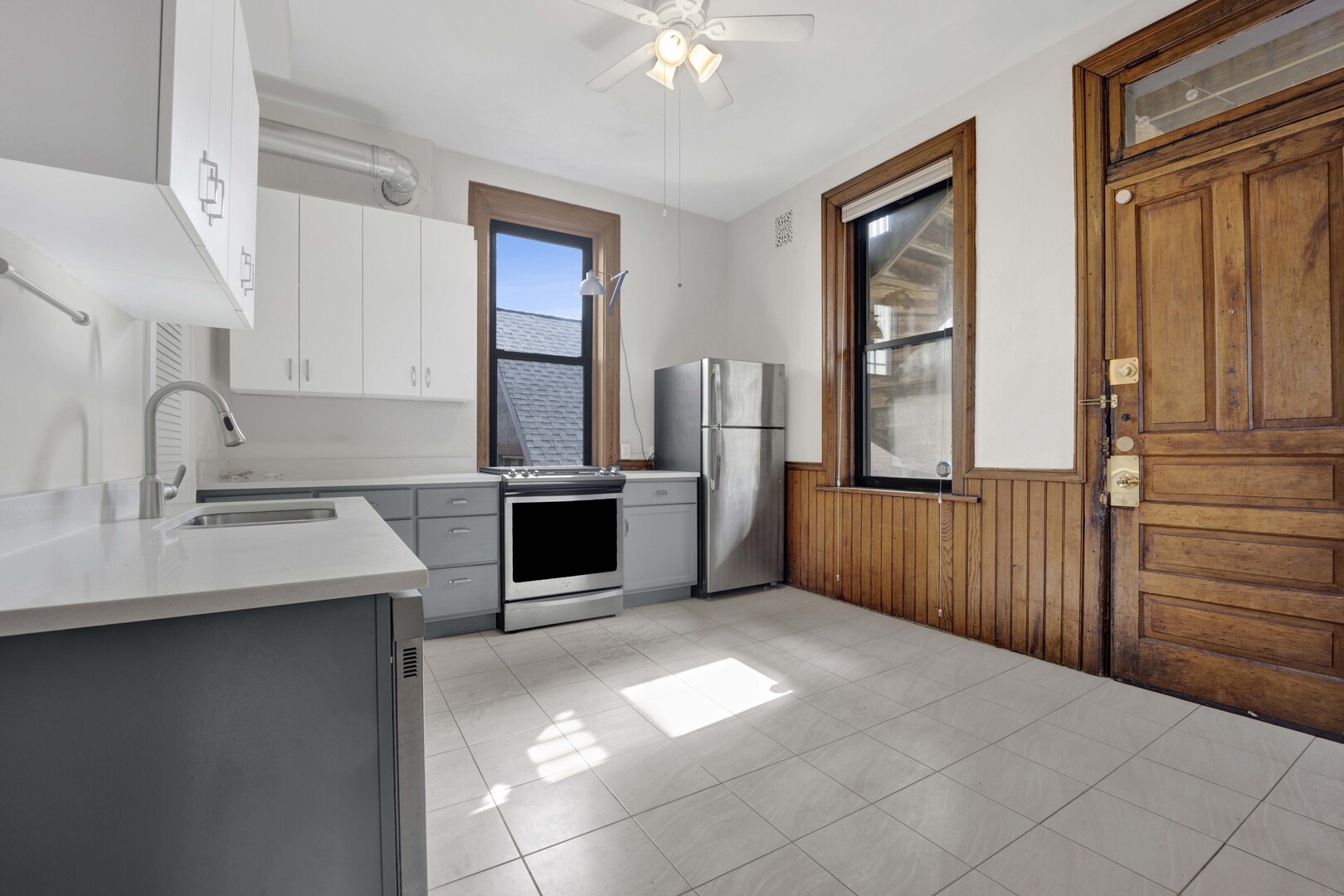 825 West Armitage Avenue, Unit 3S Chicago, IL 60614 - Photo 7 of 18 a kitchen with stainless steel appliances granite countertop a sink stove and refrigerator
