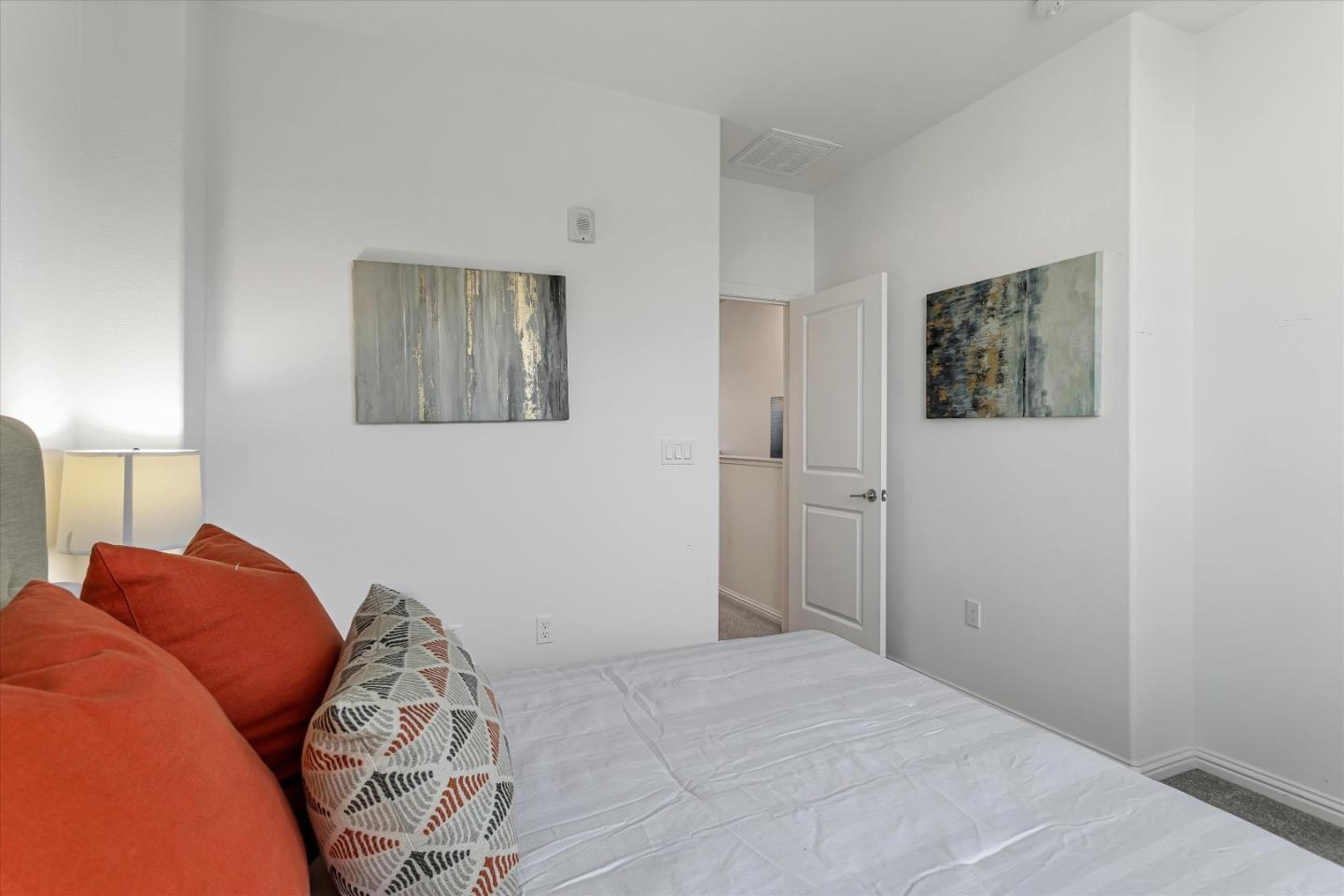 1475 Cherry Circle Milpitas, CA 95035 - Photo 13 of 33 a bedroom with a bed and a lamp