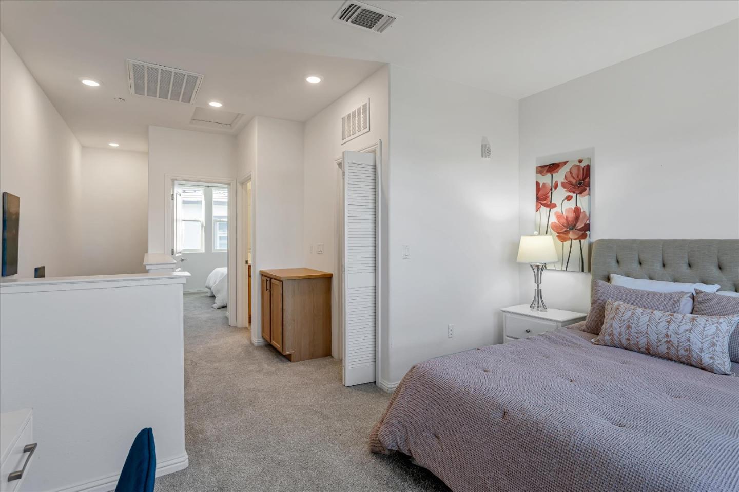 1475 Cherry Circle Milpitas, CA 95035 - Photo 16 of 33 a spacious bedroom with a bed and a cabinets